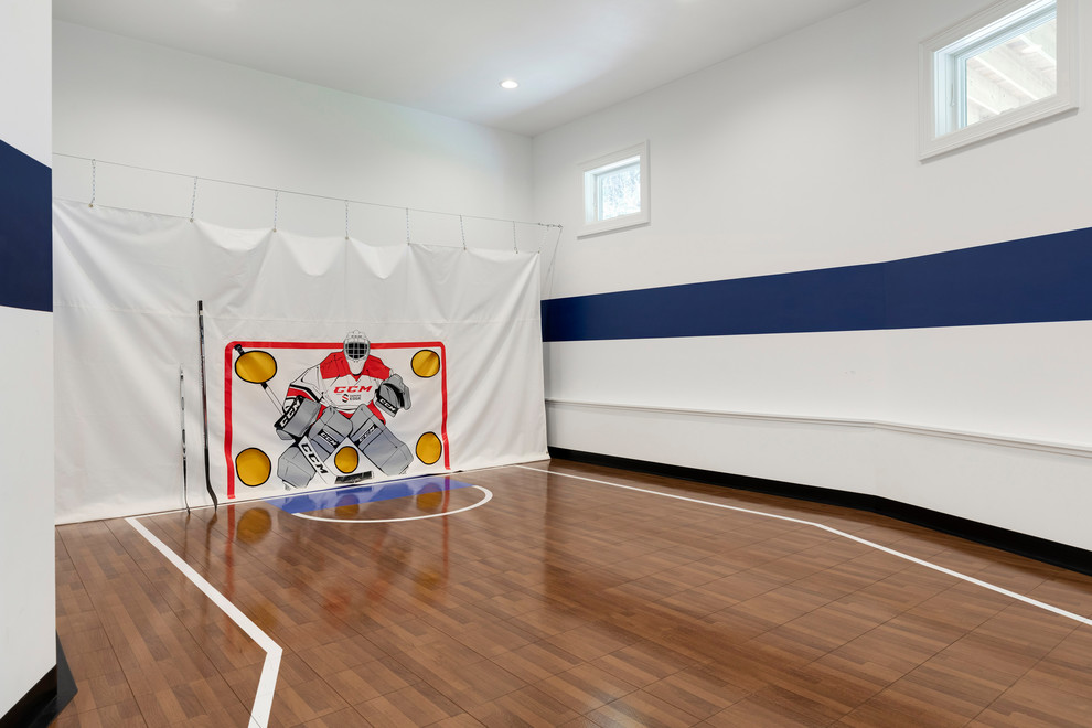 Design ideas for a large coastal indoor sports court in Minneapolis with multi-coloured walls, brown floors and medium hardwood flooring.