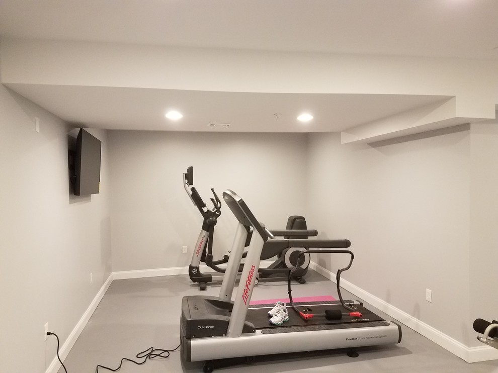 Example of a large classic carpeted and gray floor home weight room design in DC Metro with gray walls