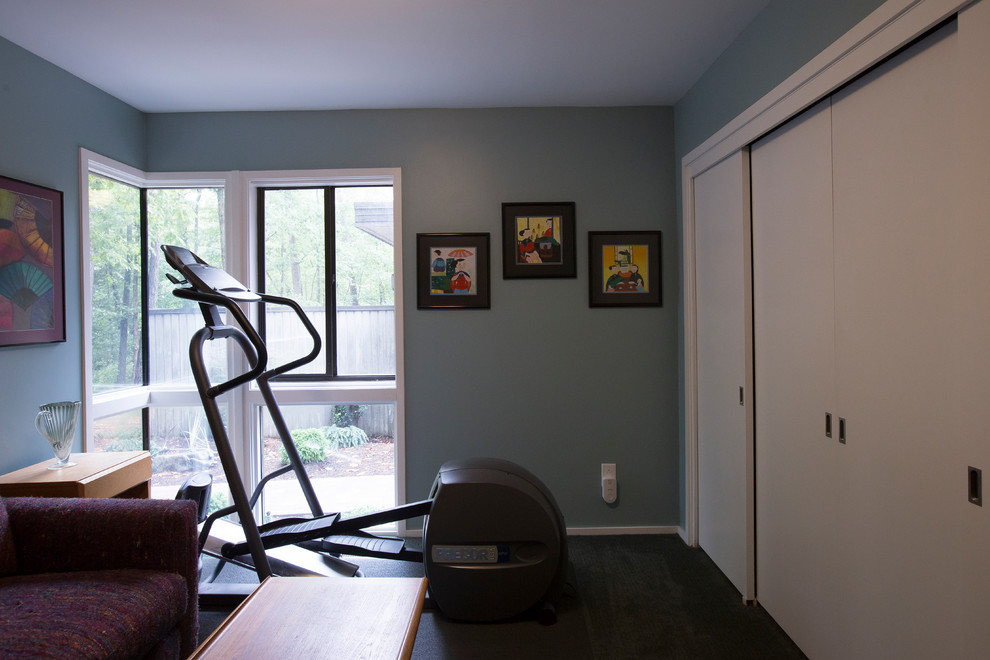 Example of a small eclectic carpeted and gray floor multiuse home gym design in Raleigh with blue walls