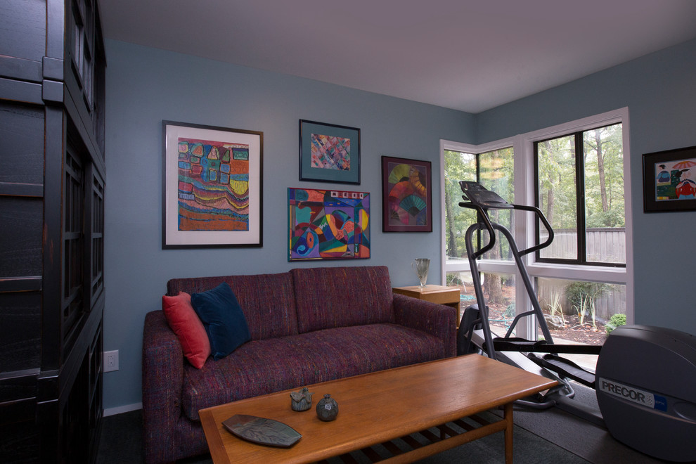 Small bohemian multi-use home gym in Raleigh with blue walls, carpet and grey floors.
