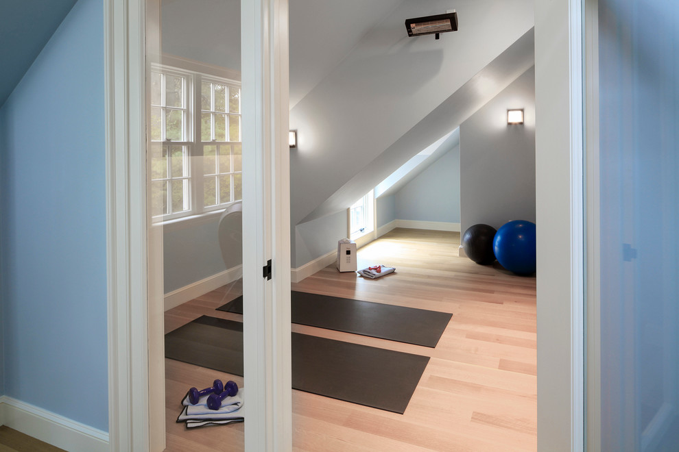 Example of a large classic light wood floor home gym design in Boston with blue walls