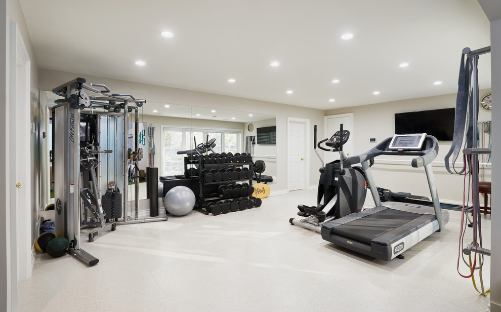 This is an example of a transitional multipurpose gym in Toronto with beige walls and white floor.