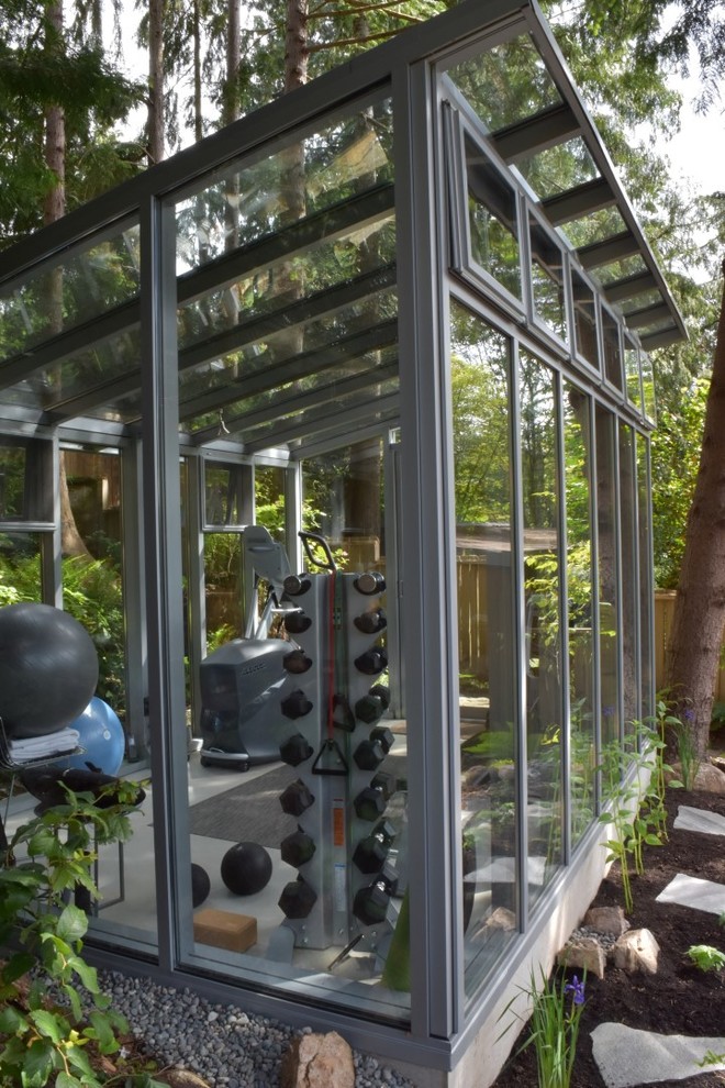 This is an example of a medium sized modern multi-use home gym in Vancouver.