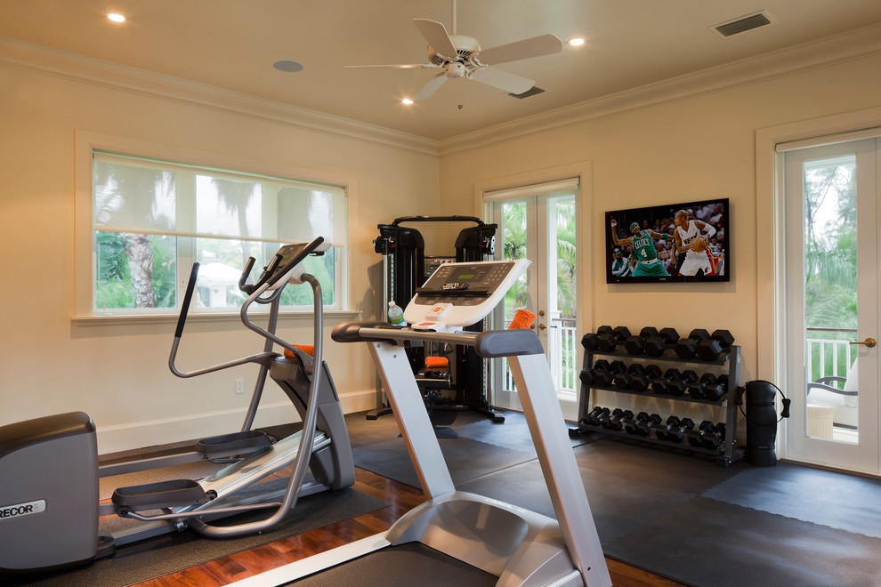 Large classic multi-use home gym in Miami with beige walls, medium hardwood flooring, brown floors, a drop ceiling and feature lighting.
