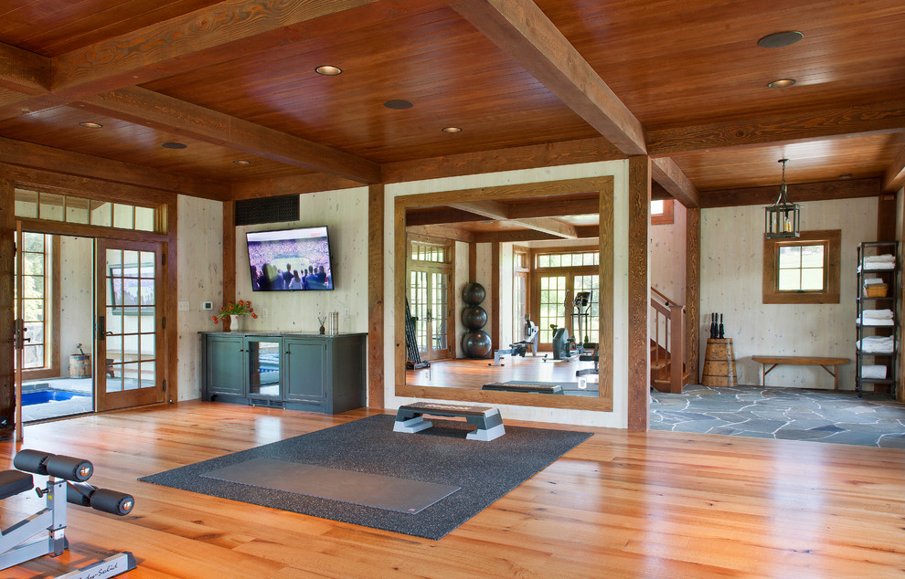 Photo of a farmhouse home yoga studio in DC Metro with orange floors.