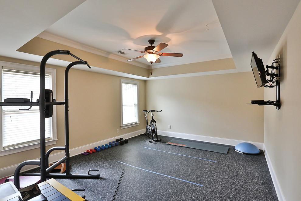 Medium sized classic multi-use home gym in Atlanta with beige walls.