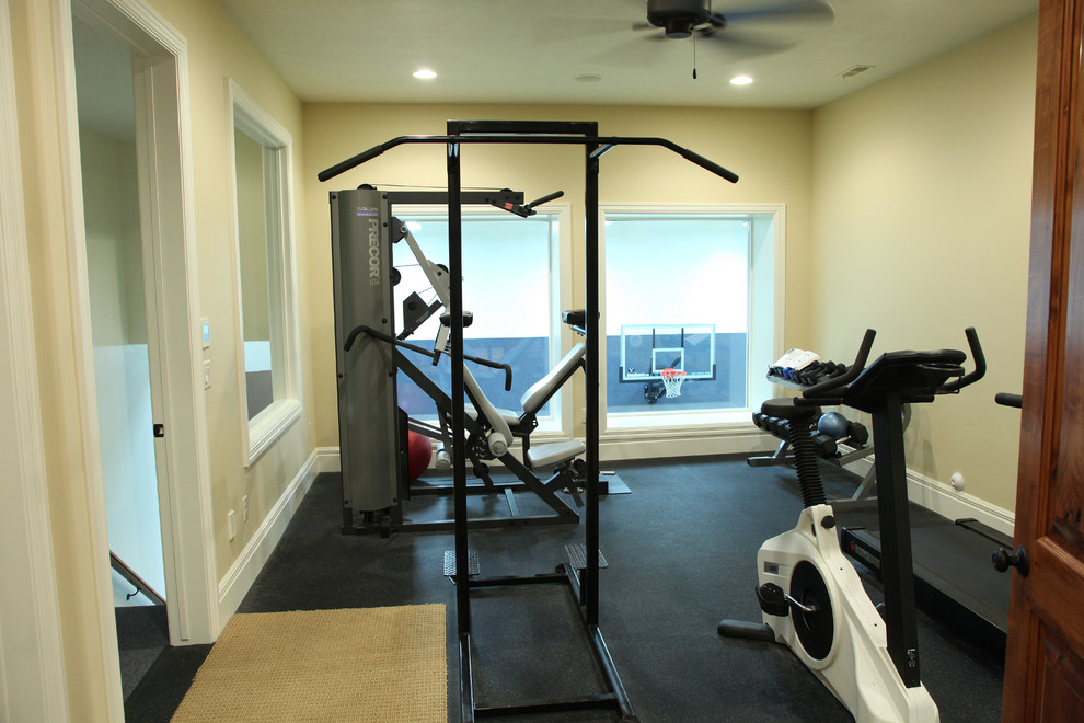 Home weight room - large traditional home weight room idea in Salt Lake City with beige walls