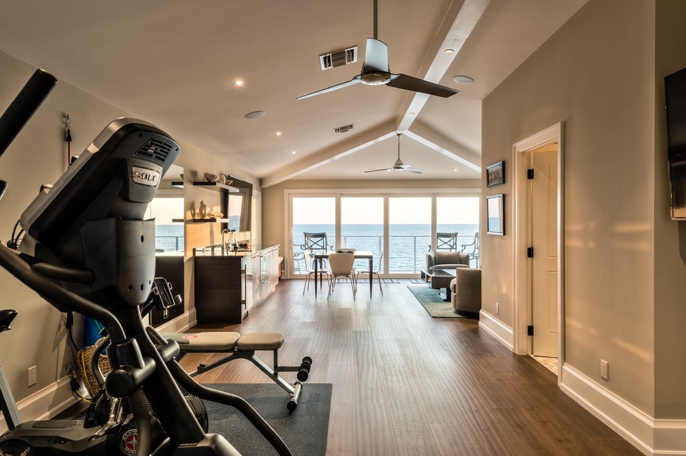Multiuse home gym - coastal medium tone wood floor multiuse home gym idea in Miami