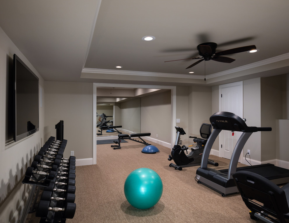 Example of a large classic beige floor and tray ceiling multiuse home gym design in Atlanta with beige walls