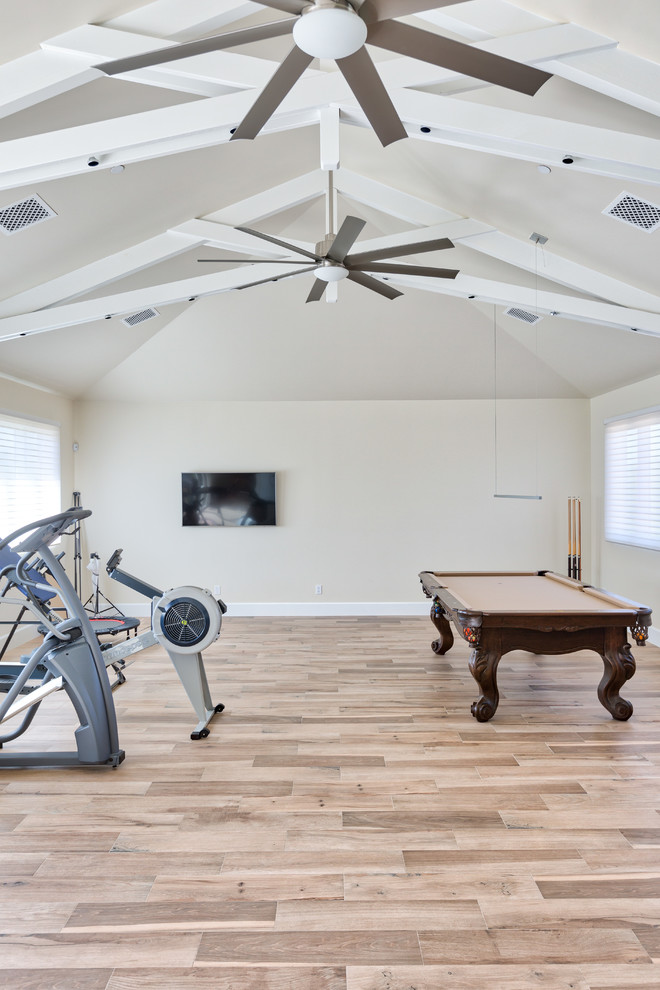 Mid-sized trendy medium tone wood floor and beige floor multiuse home gym photo in Phoenix with beige walls