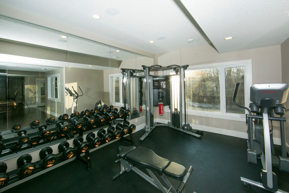 Inspiration for a large contemporary multi-use home gym in Edmonton with beige walls.
