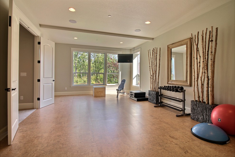 Multiuse home gym - huge craftsman cork floor and brown floor multiuse home gym idea in Portland with gray walls