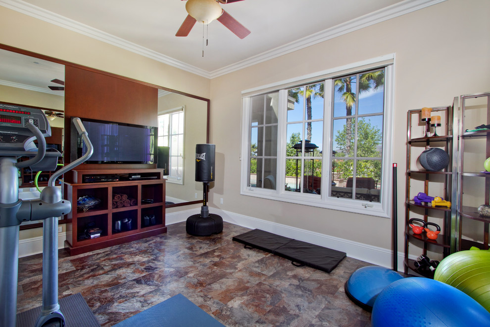 This is an example of a medium sized classic multi-use home gym in San Diego with beige walls and vinyl flooring.