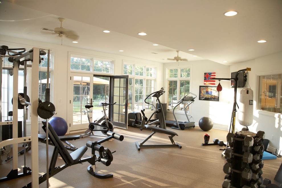 Inspiration for a traditional multi-use home gym in Detroit with white walls and beige floors.