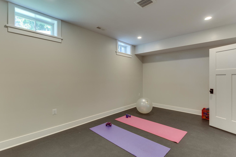Photo of a medium sized traditional multi-use home gym in DC Metro with beige walls, concrete flooring and grey floors.