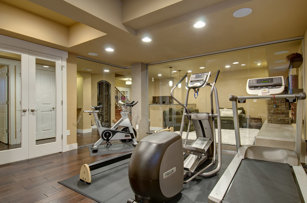 Mid-sized transitional dark wood floor and brown floor multiuse home gym photo in Denver with beige walls