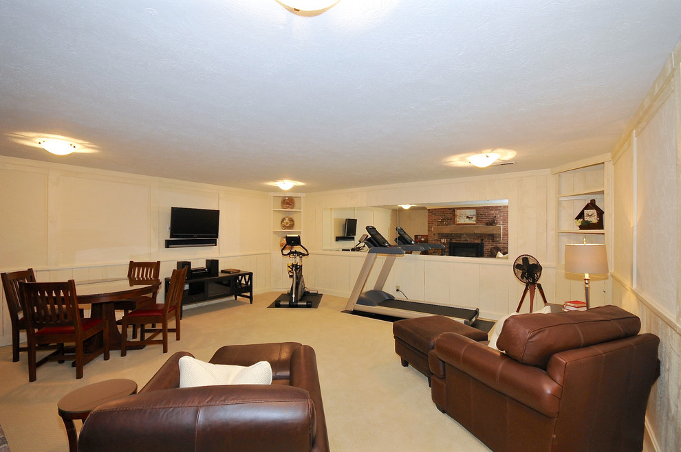 Large classic multi-use home gym in Indianapolis with white walls and carpet.