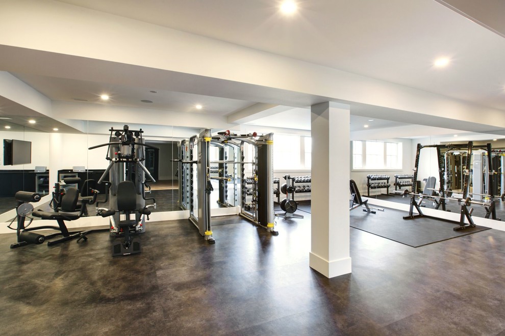Photo of an expansive contemporary home weight room in Toronto with white walls, concrete flooring and grey floors.