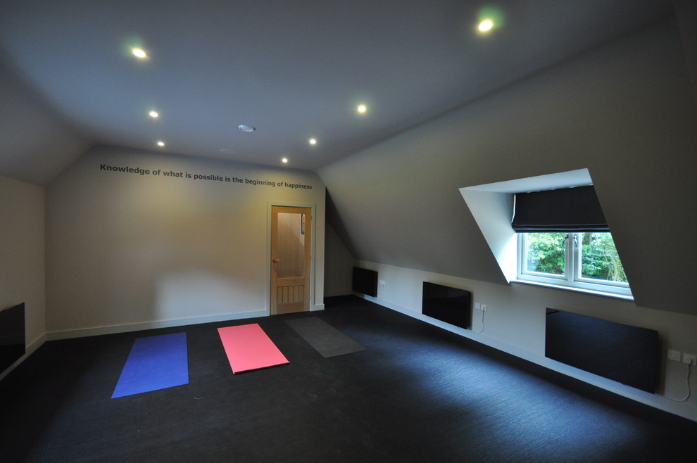 This is an example of a large contemporary home yoga studio in Wiltshire with grey walls and vinyl flooring.