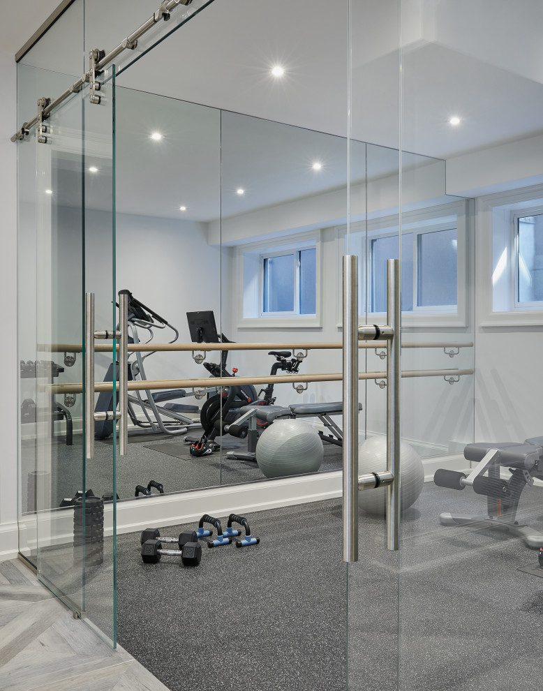Design ideas for a traditional multi-use home gym in Toronto with white walls, grey floors and a feature wall.