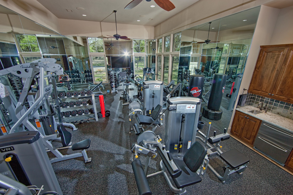 Design ideas for an expansive home weight room in Austin with beige walls.