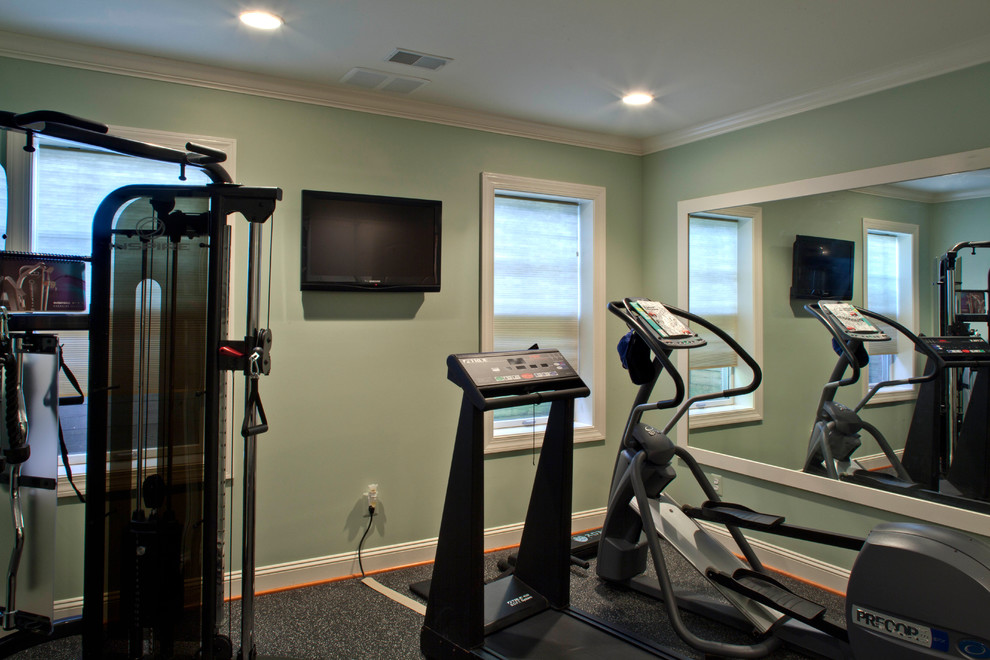 Medium sized contemporary home weight room in DC Metro with green walls.