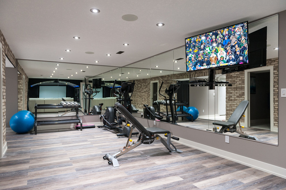 Example of a mid-sized trendy porcelain tile home weight room design in Calgary with gray walls