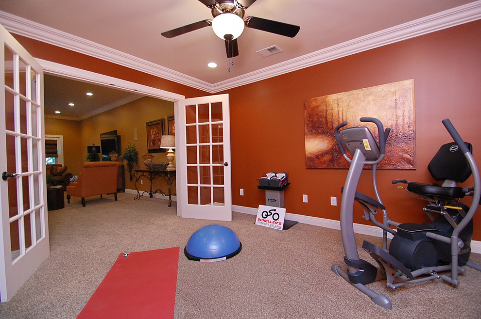 Inspiration for a medium sized traditional multi-use home gym in Louisville with red walls and carpet.