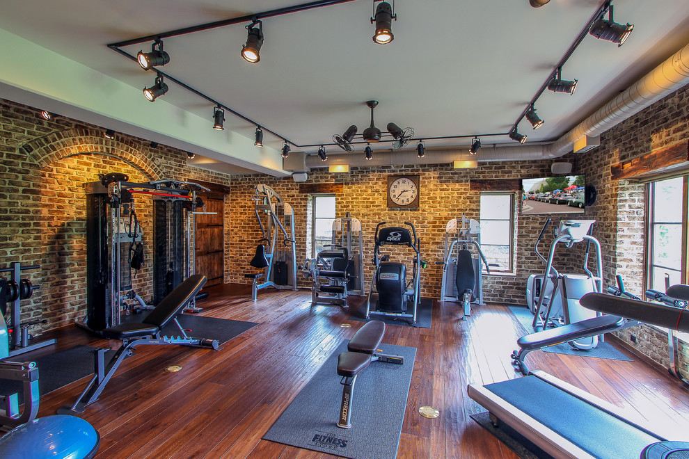Photo of a traditional home weight room in Cincinnati with medium hardwood flooring.