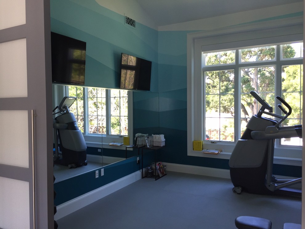 Photo of an urban home gym in San Francisco with grey floors.