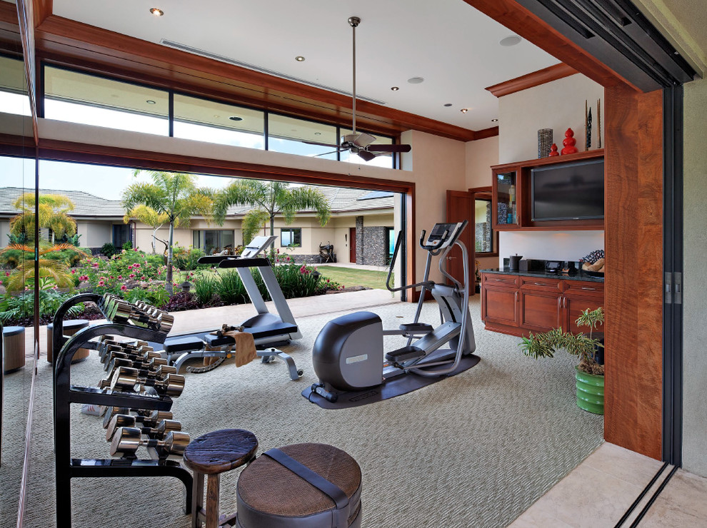 Multiuse home gym - huge tropical carpeted and gray floor multiuse home gym idea in Hawaii with beige walls