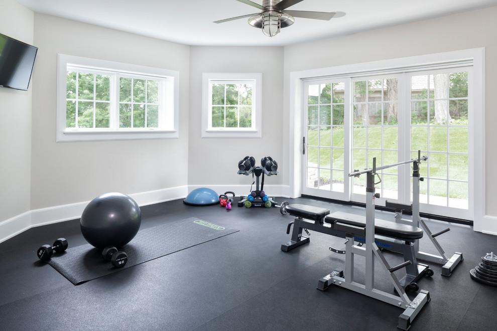 Design ideas for a coastal home gym in Minneapolis with grey walls, black floors and feature lighting.