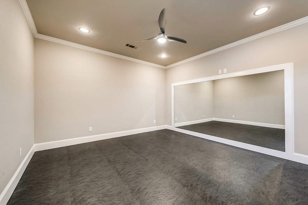Example of a large transitional cork floor multiuse home gym design in Dallas with beige walls