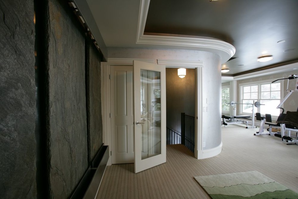 This is an example of a large traditional multi-use home gym in Minneapolis with grey walls and carpet.