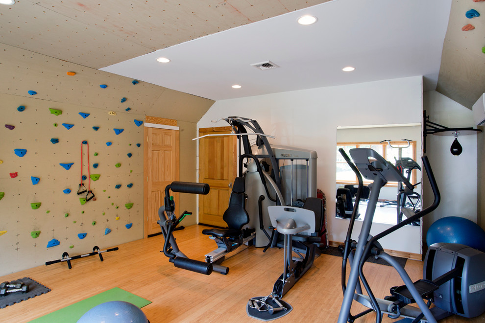 Inspiration for a medium sized nautical multi-use home gym in New York with light hardwood flooring.