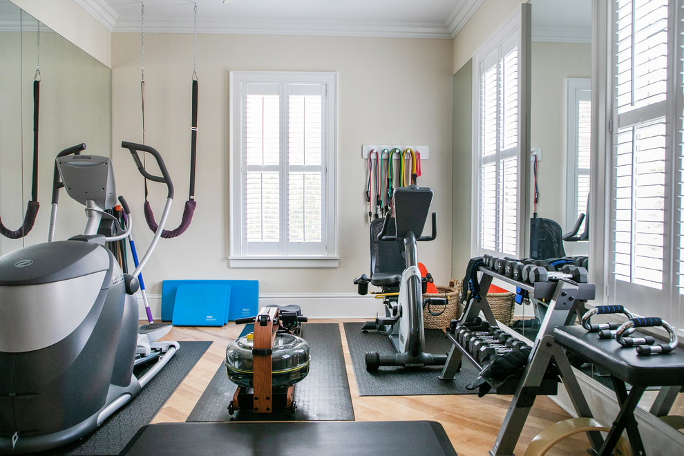 Example of a mid-sized classic light wood floor and beige floor multiuse home gym design in Milwaukee with beige walls