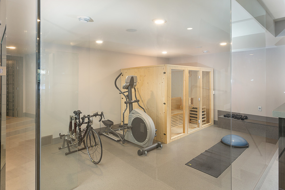 Photo of a large modern multi-use home gym in Edmonton with grey walls, marble flooring and beige floors.