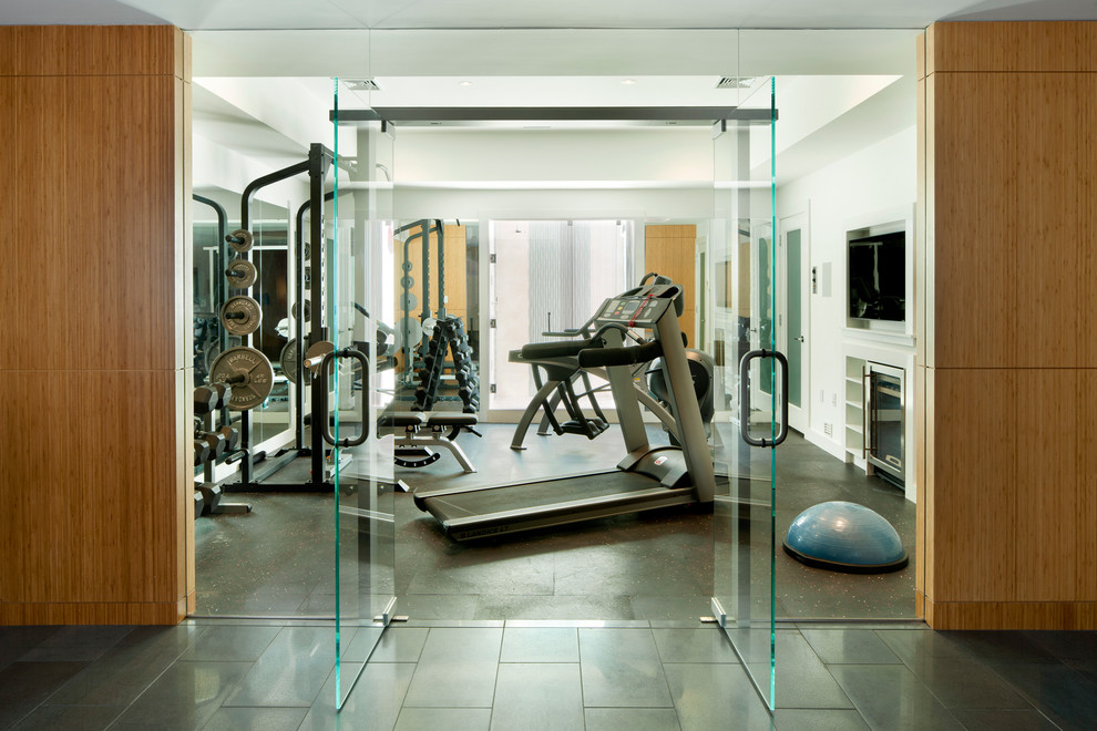 Photo of a contemporary home gym in Boston with white walls and lino flooring.