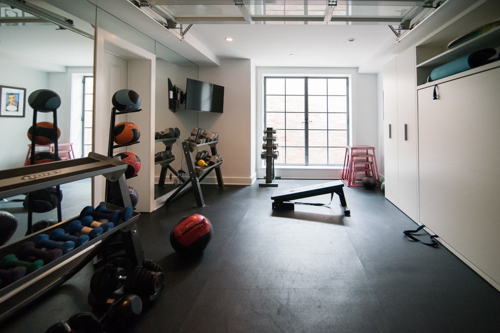 Multiuse home gym - mid-sized traditional black floor multiuse home gym idea in Los Angeles with white walls