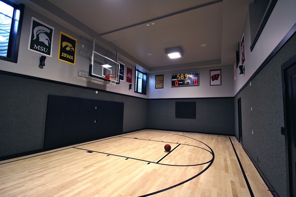 Design ideas for a large modern indoor sports court in Chicago with grey walls, light hardwood flooring and beige floors.