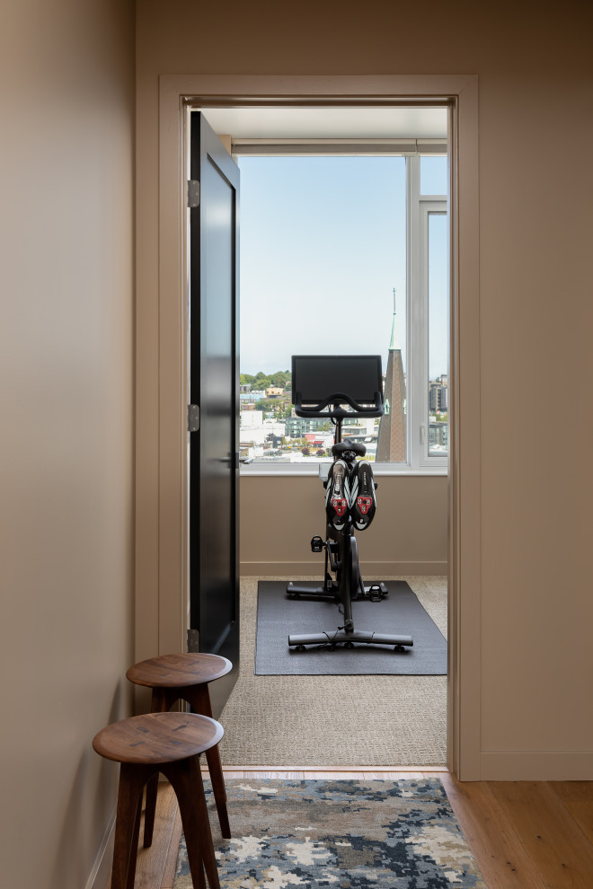 Example of a mid-sized trendy carpeted and beige floor multiuse home gym design in Seattle with beige walls