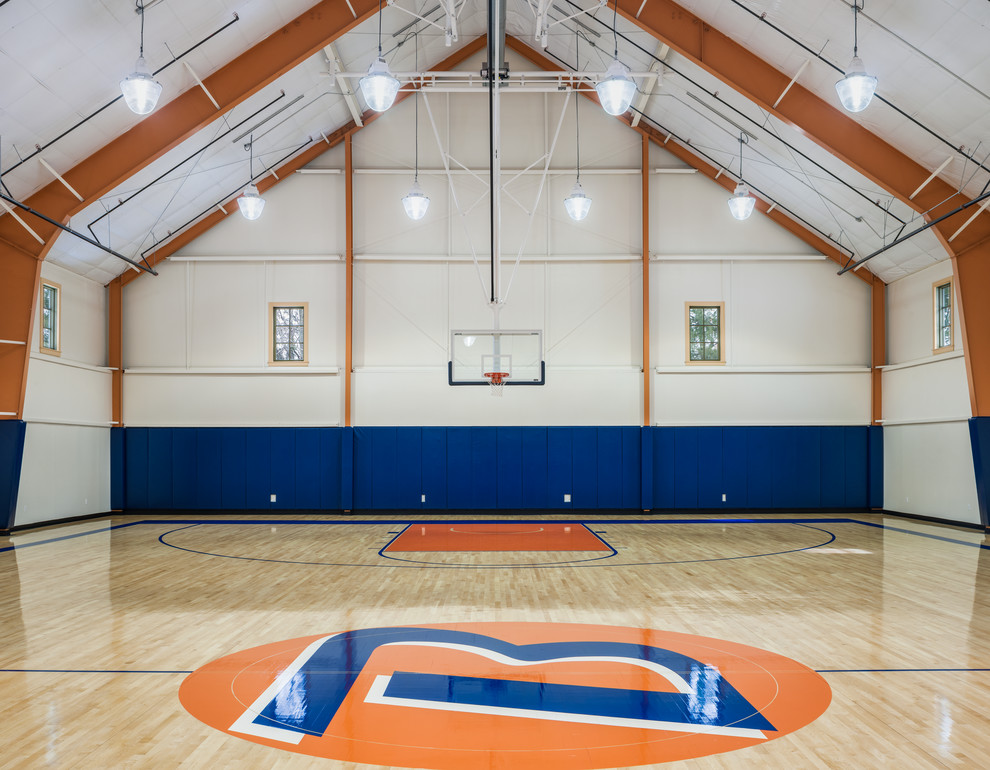 Photo of an expansive traditional indoor sports court in Philadelphia with white walls and light hardwood flooring.