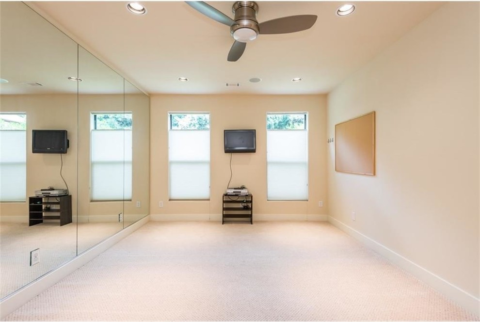 Example of a mid-sized tuscan carpeted and beige floor home yoga studio design in Atlanta with beige walls