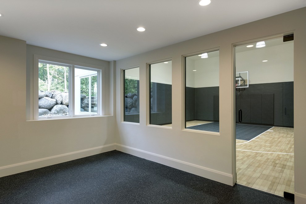 Inspiration for a large contemporary light wood floor and beige floor indoor sport court remodel in Minneapolis with black walls