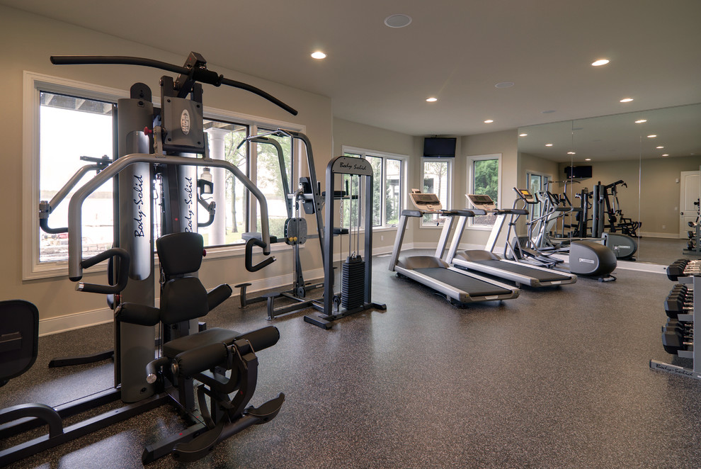 Example of a classic multiuse home gym design in Grand Rapids with beige walls