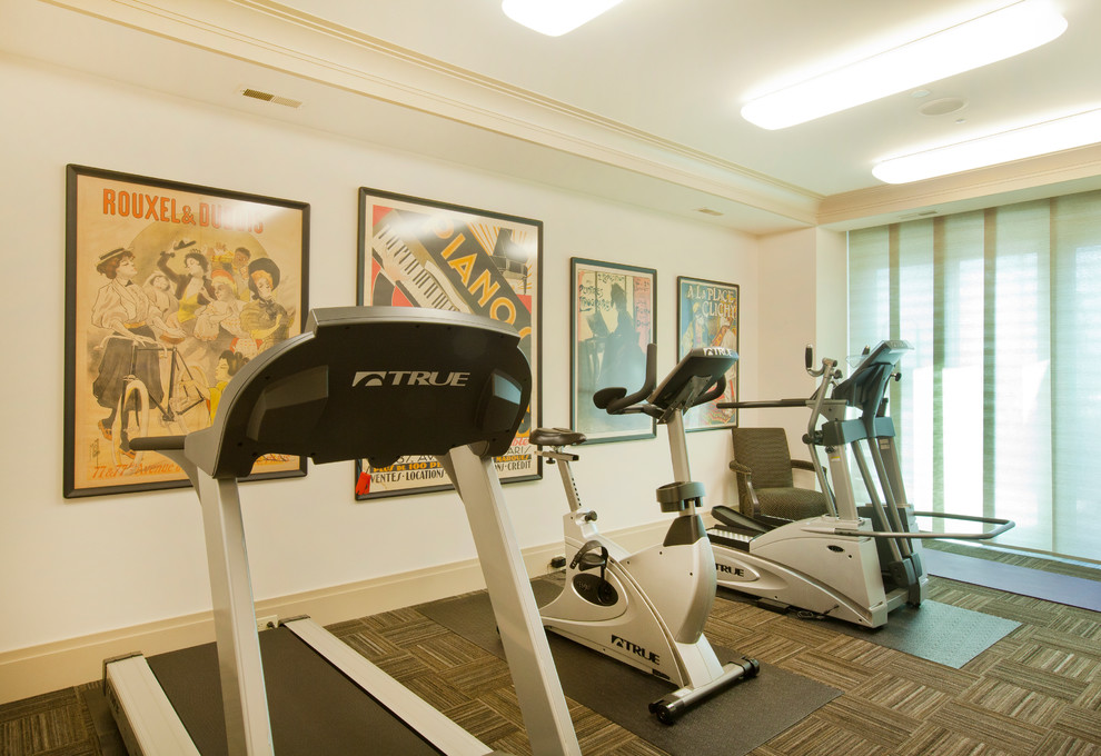Example of a large trendy carpeted multiuse home gym design in Omaha with white walls