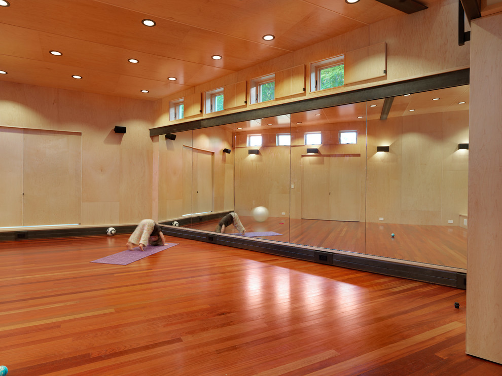 Large mountain style dark wood floor home gym photo in Burlington with beige walls