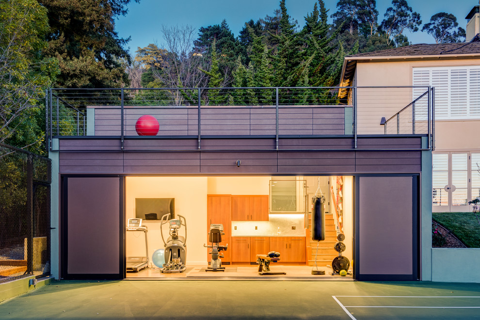 Multiuse home gym - mid-sized contemporary medium tone wood floor multiuse home gym idea in San Francisco with white walls