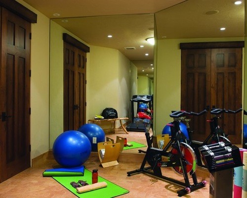 Inspiration for a rustic multi-use home gym in Denver with beige walls.
