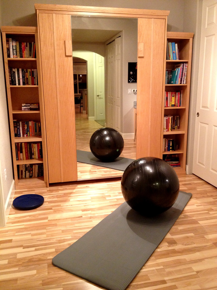 Example of a transitional home gym design in Denver